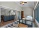 Bedroom leading into living area with sliding glass doors, daybed, and views of living room at 27018 Nature View St, Leesburg, FL 34748