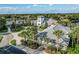 Aerial view of the clubhouse with palm trees and manicured lawns at 27018 Nature View St, Leesburg, FL 34748