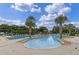 Community pool featuring palm trees, and plenty of seating for residents at 27018 Nature View St, Leesburg, FL 34748