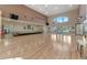 A grand event hall with a stage, hardwood floors and large windows to let in the light at 27018 Nature View St, Leesburg, FL 34748