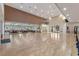 Large event hall with wood floors, arched entryways, and tables ready for gathering at 27018 Nature View St, Leesburg, FL 34748