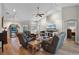 Bright living room featuring hardwood floors, vaulted ceilings, and modern furniture at 27018 Nature View St, Leesburg, FL 34748