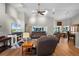 Bright living room featuring hardwood floors, vaulted ceilings, and modern furniture at 27018 Nature View St, Leesburg, FL 34748