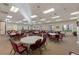 A meeting room is furnished with round tables and chairs at 27018 Nature View St, Leesburg, FL 34748