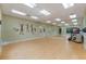 Bright dance studio with mirrors, wood floors, and wall art at 27018 Nature View St, Leesburg, FL 34748