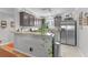 Modern kitchen with granite countertops, stainless steel appliances, and ample cabinet space at 2785 Privada Dr, The Villages, FL 32162