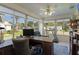 Bright sunroom featuring many windows, a ceiling fan, and versatile space at 2785 Privada Dr, The Villages, FL 32162