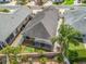 Aerial view showcasing the property's layout, screened lanai, landscaping, and neighborhood setting at 3074 Eastwood Ter, The Villages, FL 32163