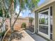 View of the home's backyard showcasing the screened lanai, lush landscaping, and a tranquil outdoor setting at 3074 Eastwood Ter, The Villages, FL 32163