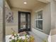 Inviting front entrance featuring a decorative glass door, sidelight, and a charming crane decoration at 3074 Eastwood Ter, The Villages, FL 32163
