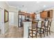 Spacious kitchen with stainless steel appliances, a breakfast bar, and ample counter space perfect for entertaining at 3074 Eastwood Ter, The Villages, FL 32163
