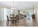 Bright living space featuring tile floors, comfortable seating, and sliding glass doors to the outdoor patio area at 3074 Eastwood Ter, The Villages, FL 32163