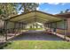 Large carport area with ample space for parking, featuring scenic water views at 31941 Tropical Shores Dr, Tavares, FL 32778