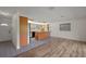 Spacious kitchen features wood cabinets, an island, and gray tile flooring, adjacent to the entry door at 31941 Tropical Shores Dr, Tavares, FL 32778