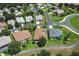 An aerial view of a residential area with well-manicured lawns and mature trees at 3257 Baltic Sea Blvd, Tavares, FL 32778