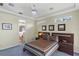 Comfortable bedroom with tray ceiling, ceiling fan, accent lighting and ensuite bathroom at 3257 Baltic Sea Blvd, Tavares, FL 32778
