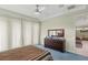 Bright bedroom with a ceiling fan, carpet, and view into another room at 3257 Baltic Sea Blvd, Tavares, FL 32778