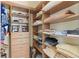 Walk-in closet with custom wood shelving and drawers providing plenty of storage at 3257 Baltic Sea Blvd, Tavares, FL 32778