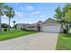 Beautiful house with a well-maintained lawn and mature landscaping at 3257 Baltic Sea Blvd, Tavares, FL 32778