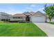 Well-maintained home with a lush lawn and mature landscaping at 3257 Baltic Sea Blvd, Tavares, FL 32778