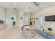 Open living room with tile flooring, high ceilings, and a view of the entryway at 3257 Baltic Sea Blvd, Tavares, FL 32778