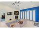 Living area with a fireplace, recessed lights, and large windows for natural light at 3257 Baltic Sea Blvd, Tavares, FL 32778
