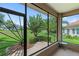 Enclosed patio with nice view of landscaped yard and walking path at 3257 Baltic Sea Blvd, Tavares, FL 32778