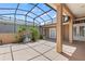 Enclosed patio with mature landscaping provides privacy and shade at 3257 Baltic Sea Blvd, Tavares, FL 32778