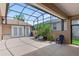Spacious screened patio with mature plants that add a touch of nature at 3257 Baltic Sea Blvd, Tavares, FL 32778