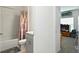 Bathroom featuring a tub with a shower, neutral vanity, and an adjacent bedroom door at 33960 Sky Blossom Cir, Leesburg, FL 34788