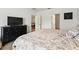 Bedroom boasts a neutral palette and carpet with an adjoining door to living areas at 33960 Sky Blossom Cir, Leesburg, FL 34788