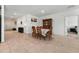 Dining room featuring a wooden table set, tile flooring, and an open floor plan connected to other living areas at 33960 Sky Blossom Cir, Leesburg, FL 34788