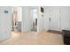 Inviting foyer with tile flooring, leading to various rooms and a glimpse of a nearby bathroom at 33960 Sky Blossom Cir, Leesburg, FL 34788