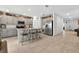 Spacious kitchen has breakfast bar seating, stainless appliances, and pantry at 33960 Sky Blossom Cir, Leesburg, FL 34788