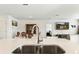 Open concept kitchen with a view of the dining and living area at 33960 Sky Blossom Cir, Leesburg, FL 34788