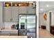 Kitchen boasts stainless steel refrigerator, ample cabinetry, and a charming decor at 33960 Sky Blossom Cir, Leesburg, FL 34788