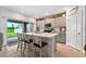 Bright kitchen with modern appliances, breakfast bar, and sliding glass doors at 33960 Sky Blossom Cir, Leesburg, FL 34788