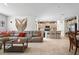 The living room features an open floor plan with the kitchen, dining area, and tile flooring at 33960 Sky Blossom Cir, Leesburg, FL 34788