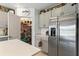 Walk-in pantry provides generous storage in this modern kitchen at 33960 Sky Blossom Cir, Leesburg, FL 34788