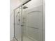 Modern shower featuring glass doors, rainfall showerhead and handheld sprayer at 33960 Sky Blossom Cir, Leesburg, FL 34788