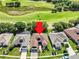 Aerial view of a single-Gathering home on a golf course with a mature landscaped yard and a screened-in pool at 3519 Arlington Ridge Blvd, Leesburg, FL 34748