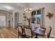 Elegant dining room with wood floors, stylish chandelier, and a formal dining table at 3519 Arlington Ridge Blvd, Leesburg, FL 34748