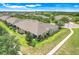 Aerial view of the house showcasing the roof, landscaping, and neighborhood at 3550 Fairwaters Ct # D, Clermont, FL 34711