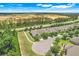 Aerial view of the house showcasing the roof, landscaping, and surrounding area at 3550 Fairwaters Ct # D, Clermont, FL 34711