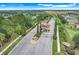 Community entrance with a fountain, landscaped medians, and a controlled access gate at 3550 Fairwaters Ct # D, Clermont, FL 34711