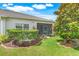 Charming home with a screened lanai, well-manicured lawn, and beautiful landscaping at 3550 Fairwaters Ct # D, Clermont, FL 34711