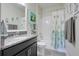 Well-lit bathroom featuring a vanity with granite countertop and a shower-tub combination at 3550 Fairwaters Ct # D, Clermont, FL 34711
