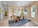 Cozy dining area with stylish decor, neutral tones, and view to the living room at 3550 Fairwaters Ct # D, Clermont, FL 34711