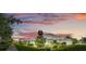 Picturesque street view of single-story homes with colorful sunset backdrop at 3550 Fairwaters Ct # D, Clermont, FL 34711
