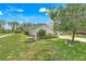 Well-kept front yard with a lush lawn, mature trees, landscaping, and a charming residential setting at 3550 Fairwaters Ct # D, Clermont, FL 34711
